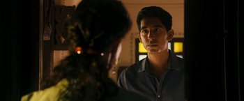 Movie still from “The Second Best Exotic Marigold Hotel” (2015), directed by John Madden – A man looking at a woman in the mirror; Close Up shot, Over the shoulder angle