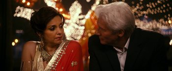 Movie still from “The Second Best Exotic Marigold Hotel” (2015), directed by John Madden – A man and a woman talking to each other; Close Up shot, Over the shoulder angle
