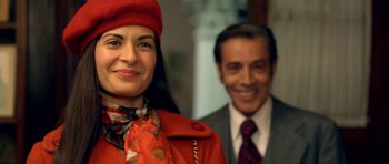 Movie still from “The Secret in Their Eyes” (2009), directed by Juan José Campanella – A man and a woman smiling for the camera; Close Up shot, Over the shoulder angle