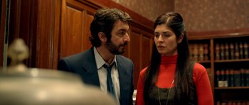 Movie still from “The Secret in Their Eyes” (2009), directed by Juan José Campanella – A man and a woman standing next to each other in a room; Close Up shot, Over the shoulder angle