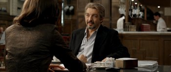 Movie still from “The Secret in Their Eyes” (2009), directed by Juan José Campanella – A man sitting at a table in front of a woman; Close Up shot, Over the shoulder angle