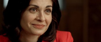 Movie still from “The Secret in Their Eyes” (2009), directed by Juan José Campanella – A woman's face in a red jacket; Close Up shot, Over the shoulder angle