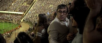 Movie still from “The Secret in Their Eyes” (2009), directed by Juan José Campanella – A crowd of people in a stadium watching a game; Medium shot, Low angle
