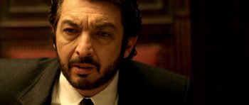 Movie still from “The Secret in Their Eyes” (2009), directed by Juan José Campanella – A person wearing a suit and tie; Close Up shot, Low angle