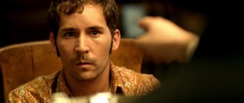 Movie still from “The Secret in Their Eyes” (2009), directed by Juan José Campanella – A person sitting in front of a camera; Close Up shot, Over the shoulder angle