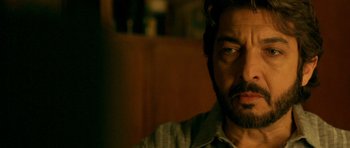 Movie still from “The Secret in Their Eyes” (2009), directed by Juan José Campanella – A person looking at the camera; Close Up shot, Over the shoulder angle