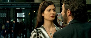 Movie still from “The Secret in Their Eyes” (2009), directed by Juan José Campanella – A person wearing a necklace; Close Up shot, Over the shoulder angle