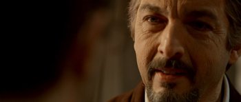 Movie still from “The Secret in Their Eyes” (2009), directed by Juan José Campanella – A man with a beard and mustache; Close Up shot, Over the shoulder angle