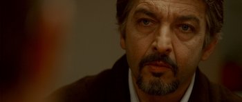 Movie still from “The Secret in Their Eyes” (2009), directed by Juan José Campanella – A person with a beard; Close Up shot, Over the shoulder angle