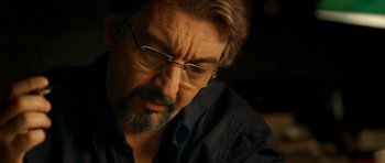 Movie still from “The Secret in Their Eyes” (2009), directed by Juan José Campanella – A person wearing glasses; Close Up shot, Over the shoulder angle