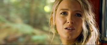Movie still from “The Shallows” (2016), directed by Jaume Collet-Serra – A woman's face in a forest setting; Close Up shot, Low angle