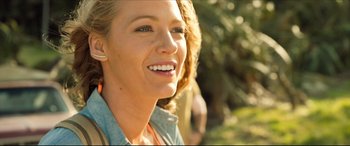 Movie still from “The Shallows” (2016), directed by Jaume Collet-Serra – A person with a smile on their face; Close Up shot, Over the shoulder angle