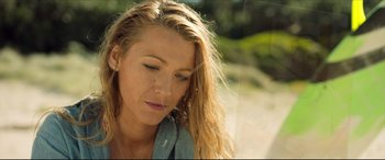 Movie still from “The Shallows” (2016), directed by Jaume Collet-Serra – A person with long blonde hair; Close Up shot, Low angle