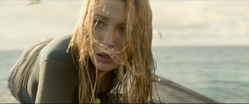 Movie still from “The Shallows” (2016), directed by Jaume Collet-Serra – A person with wet hair; Close Up shot, Low angle