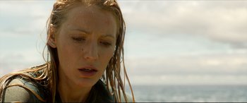 Movie still from “The Shallows” (2016), directed by Jaume Collet-Serra – A person with wet hair; Close Up shot, Low angle