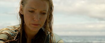 Movie still from “The Shallows” (2016), directed by Jaume Collet-Serra – A person with wet hair; Close Up shot, Low angle