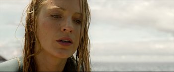 Movie still from “The Shallows” (2016), directed by Jaume Collet-Serra – A person with wet hair; Close Up shot, Low angle
