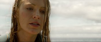 Movie still from “The Shallows” (2016), directed by Jaume Collet-Serra – A person with wet hair; Close Up shot, Low angle