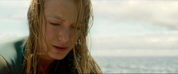 Movie still from “The Shallows” (2016), directed by Jaume Collet-Serra – A person with wet hair; Close Up shot, Low angle