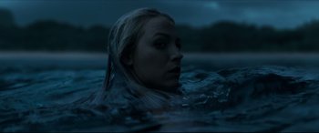 Movie still from “The Shallows” (2016), directed by Jaume Collet-Serra – A woman in the water at night; Close Up shot, Low angle