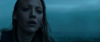 Movie still from “The Shallows” (2016), directed by Jaume Collet-Serra – A person with wet hair; Close Up shot, Low angle