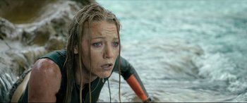 Movie still from “The Shallows” (2016), directed by Jaume Collet-Serra – A woman in a wetsuit in the water; Close Up shot, High angle