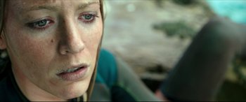 Movie still from “The Shallows” (2016), directed by Jaume Collet-Serra – A woman's face with tears in her eyes; Close Up shot, High angle