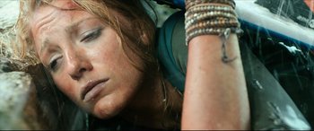 Movie still from “The Shallows” (2016), directed by Jaume Collet-Serra – A person wearing headphones with their eyes closed; Close Up shot, Low angle