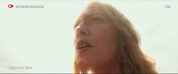 Movie still from “The Shallows” (2016), directed by Jaume Collet-Serra – A woman's face in the sunlight; Close Up shot, Low angle