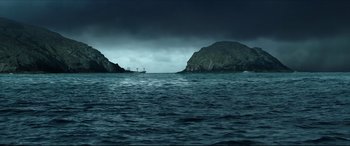 Movie still from “The Shallows” (2016), directed by Jaume Collet-Serra – A boat in the middle of a body of water; Extreme Wide shot, High angle