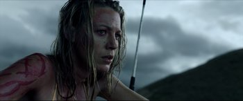 Movie still from “The Shallows” (2016), directed by Jaume Collet-Serra – A person with long blonde hair; Close Up shot, Low angle