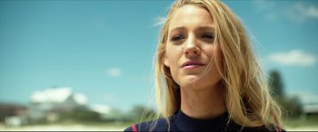 Movie still from “The Shallows” (2016), directed by Jaume Collet-Serra – A person wearing a wetsuit; Close Up shot, Low angle