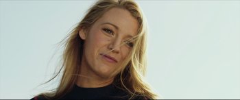 Movie still from “The Shallows” (2016), directed by Jaume Collet-Serra – A person with long blonde hair; Close Up shot, Low angle