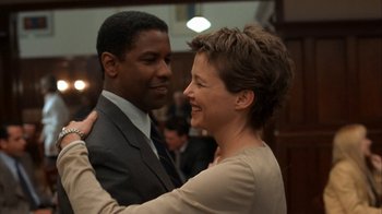 Movie still from “The Siege” (1998), directed by Edward Zwick – A man and a woman are dancing in a room; Close Up shot, Low angle