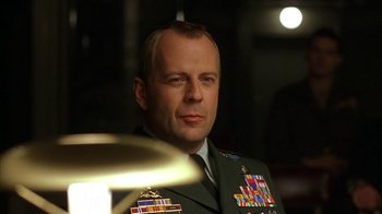 Movie still from “The Siege” (1998), directed by Edward Zwick – A person wearing a military uniform; Close Up shot, Low angle
