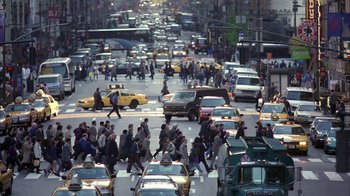 Movie still from “The Siege” (1998), directed by Edward Zwick – A busy city street filled with lots of traffic; Extreme Wide shot, High angle