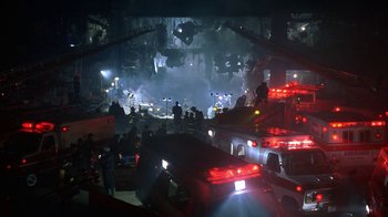 Movie still from “The Siege” (1998), directed by Edward Zwick – A group of firemen standing next to each other in a building; Extreme Wide shot, High angle