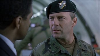 Movie still from “The Siege” (1998), directed by Edward Zwick – A man in a military uniform talking to another man in fatigues; Close Up shot, Over the shoulder angle