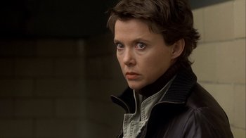 Movie still from “The Siege” (1998), directed by Edward Zwick – A person wearing a jacket; Close Up shot, Over the shoulder angle