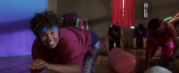 Movie still from “The Sisterhood of the Traveling Pants” (2005), directed by Ken Kwapis – Two women are practicing yoga in a room; Medium shot, Over the shoulder angle