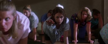 Movie still from “The Sisterhood of the Traveling Pants” (2005), directed by Ken Kwapis – A group of people doing various yoga poses; Medium shot, Low angle