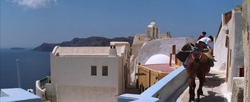 Movie still from “The Sisterhood of the Traveling Pants” (2005), directed by Ken Kwapis – A view of a building from the roof of a building; Extreme Wide shot, Low angle