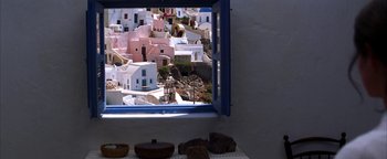 Movie still from “The Sisterhood of the Traveling Pants” (2005), directed by Ken Kwapis – A view of a city from a window of a building; Extreme Wide shot, High angle