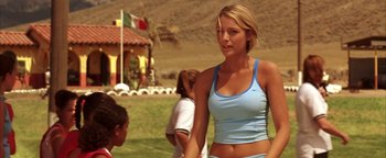 Movie still from “The Sisterhood of the Traveling Pants” (2005), directed by Ken Kwapis – A beautiful young woman in a blue tank top; Medium shot, Over the shoulder angle