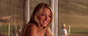 Movie still from “The Sisterhood of the Traveling Pants” (2005), directed by Ken Kwapis – A beautiful young lady smiling for the camera; Close Up shot, Low angle