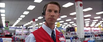 Movie still from “The Sisterhood of the Traveling Pants” (2005), directed by Ken Kwapis – A man wearing a red vest and a blue tie; Close Up shot, Low angle