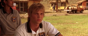 Movie still from “The Sisterhood of the Traveling Pants” (2005), directed by Ken Kwapis – A young man with blonde hair wearing a polo shirt; Close Up shot, Over the shoulder angle