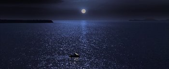 Movie still from “The Sisterhood of the Traveling Pants” (2005), directed by Ken Kwapis – A boat floating on top of a large body of water at night; Extreme Wide shot, High angle