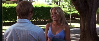 Movie still from “The Sisterhood of the Traveling Pants” (2005), directed by Ken Kwapis – A woman in a blue top is talking to a man in a white shirt; Medium shot, Over the shoulder angle
