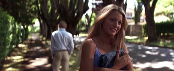 Movie still from “The Sisterhood of the Traveling Pants” (2005), directed by Ken Kwapis – A woman standing next to a man in a park; Medium shot, Over the shoulder angle